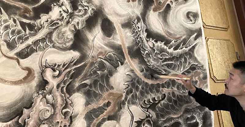 The Chinese dragon painter Long You drawing an ‘ink-wash painting’ dragon 