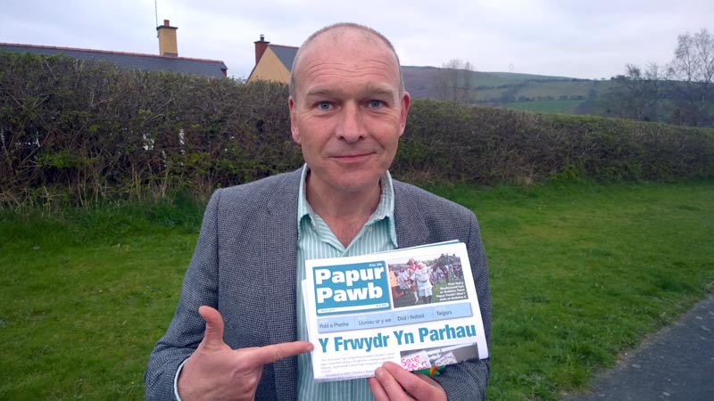 The Battle Continues: Mike Parker holding up Papur Pawb